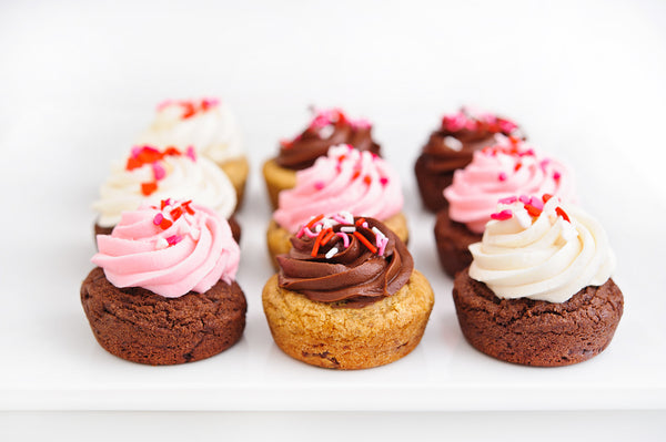 Nine Cookie Cupcakes with Pink, White, and Chocolate Frosting